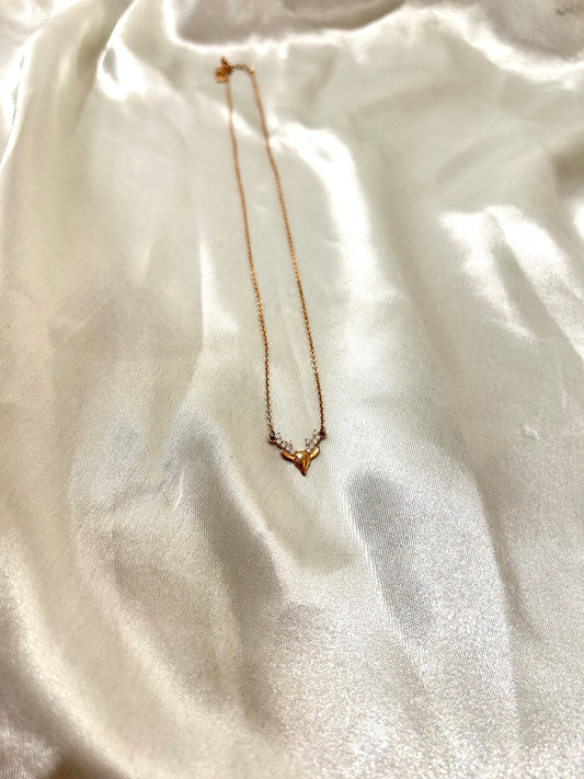 Rose gold necklace on a white fabric background, necklace for women, rose gold antler necklace,
