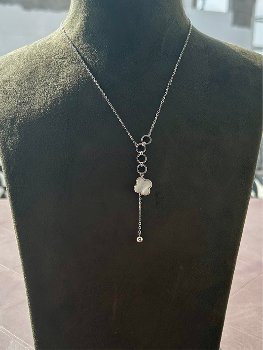 Silver necklace with a floral pendant on a mannequin, orla necklace,